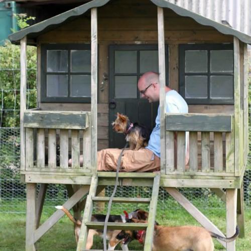 Ross with one of our dogs in the doggy house
